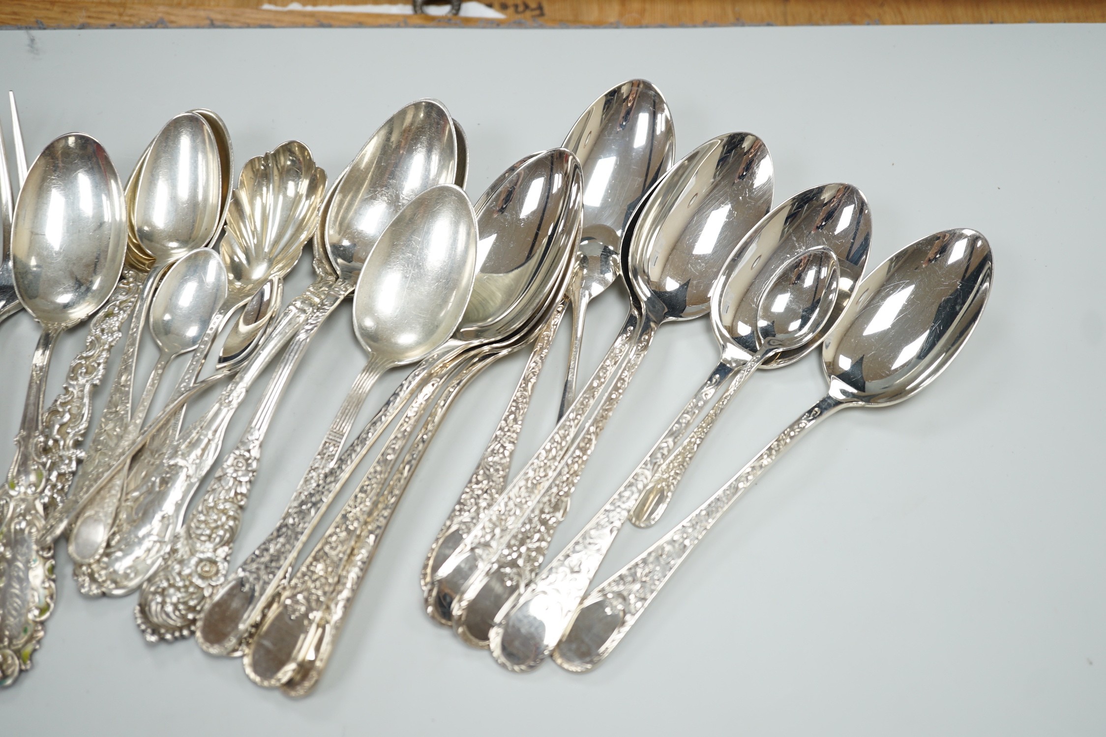 Five Canadian Birks sterling table forks, one sterling teaspoon and six sterling handled table knives, together with seven items of sterling flatware, a Hanau white metal ornate spoon and fifteen items of Birks Regency p